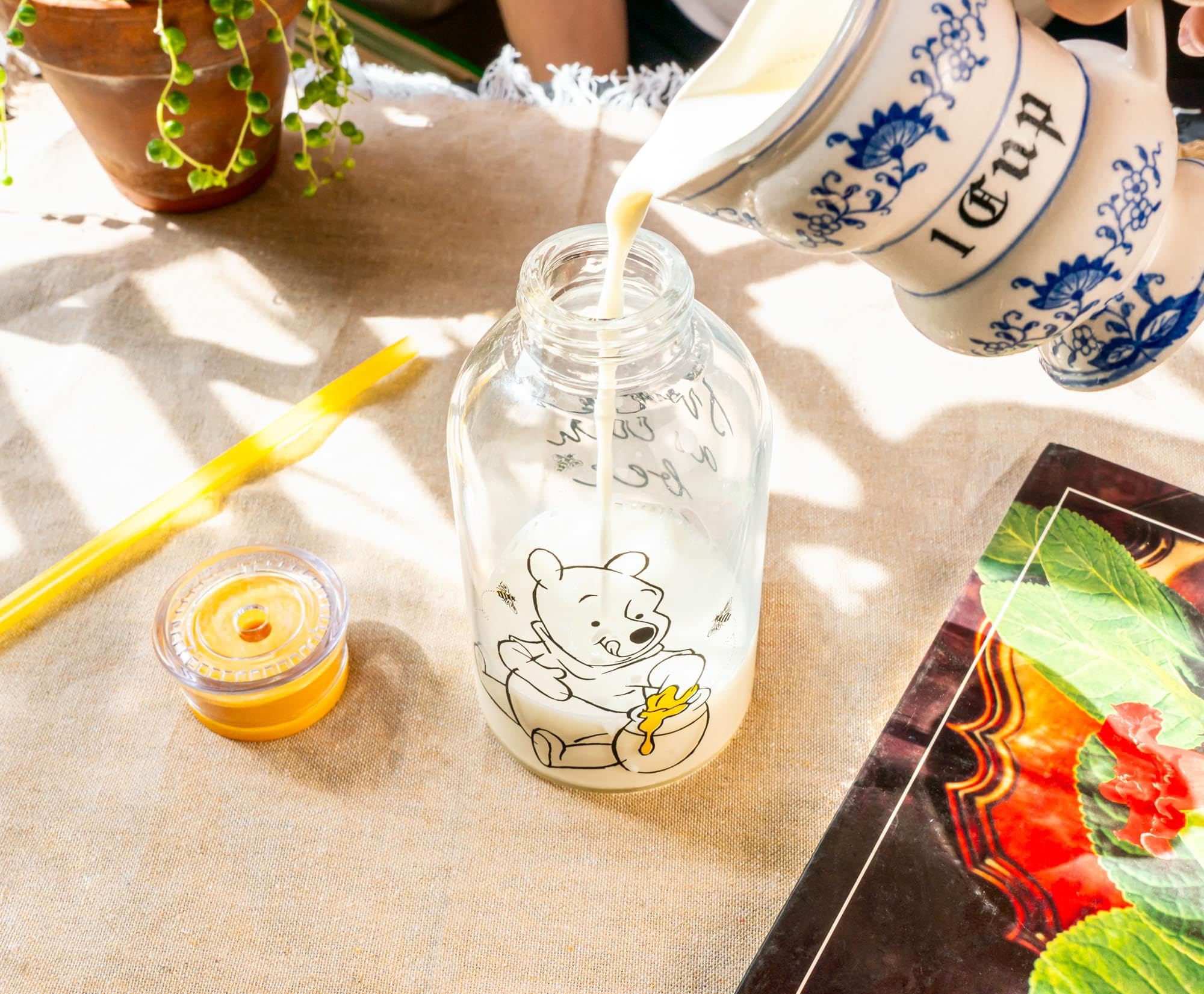 Silver Buffalo Disney Winnie the Pooh Hunny Sweet As Can Bee Glass Milk Bottle with Straw, 15 Ounces