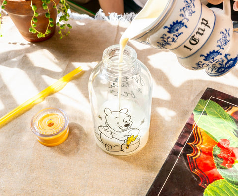 Silver Buffalo Disney Winnie the Pooh Hunny Sweet As Can Bee Glass Milk Bottle with Straw, 15 Ounces